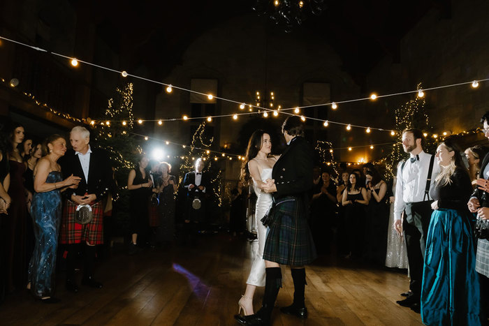 people dancing at a wedding.