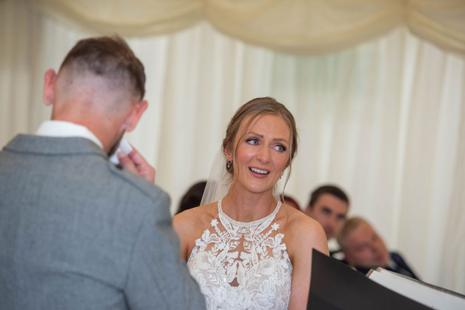 A Bride Wearing A Ivory Halterneck Wedding Dress