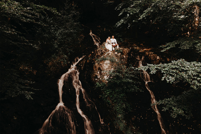 Couple sitting on rocks 