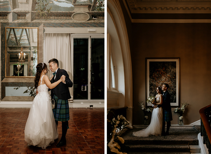 Bride and groom hold onto one another as they dance and pose on staircase