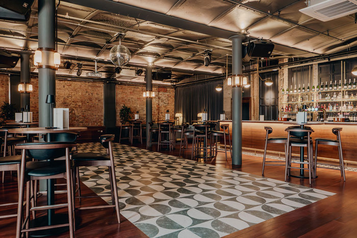 the print room bar area with seating and large patterned dancefloor at the exchange in glasgow