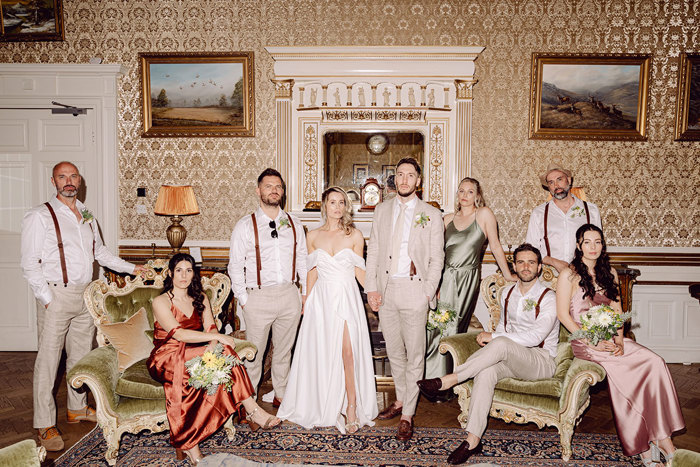 wedding party stand for posed photograph at drumtochty castle