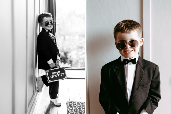 Young male holding ring security box and wearing suit and sunglasses