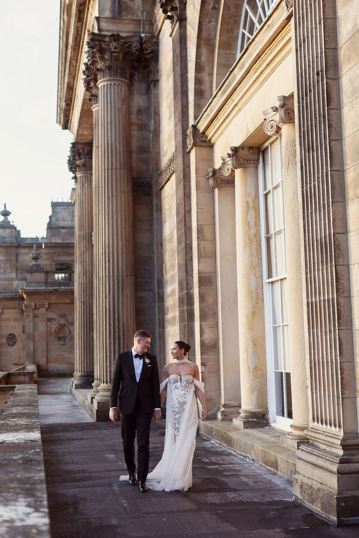 a bride and groom walking outside Gosford House.