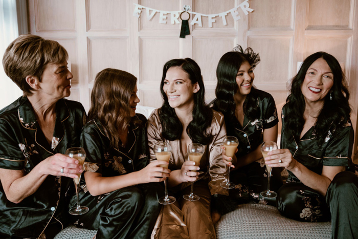 The bride and her bridesmaids in their pyjamas on the wedding morning