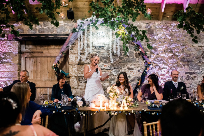 Bride gives a speech during wedding