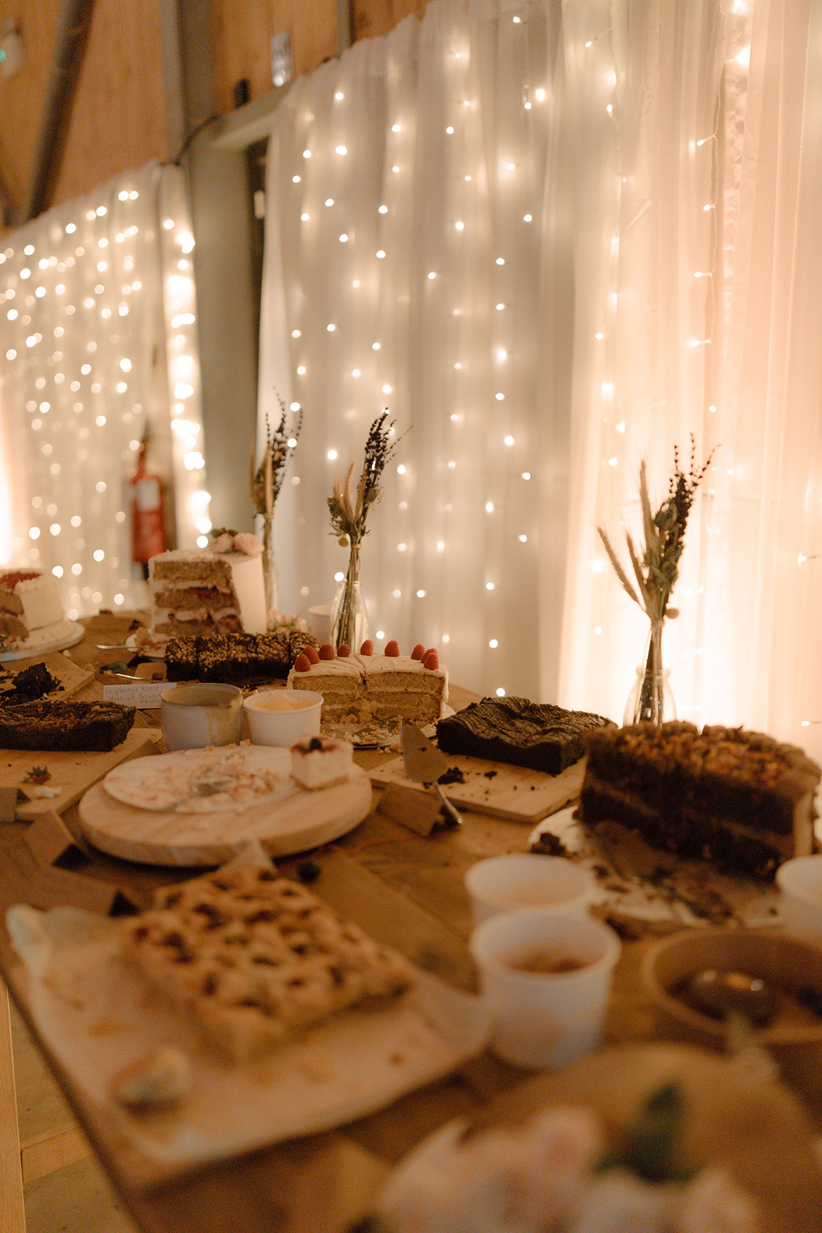 wedding cake table in wedding barn at Carrick Castle Estate