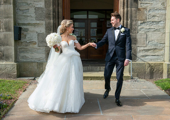 A Bride Wearing A Martina Liana Wedding Dress With A Groom Wearing A Black Dinner Suit Outside St Peters & St Andrews Church In Thurso