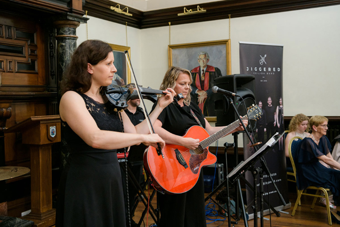 Musicians from Jiggered band playing instruments 