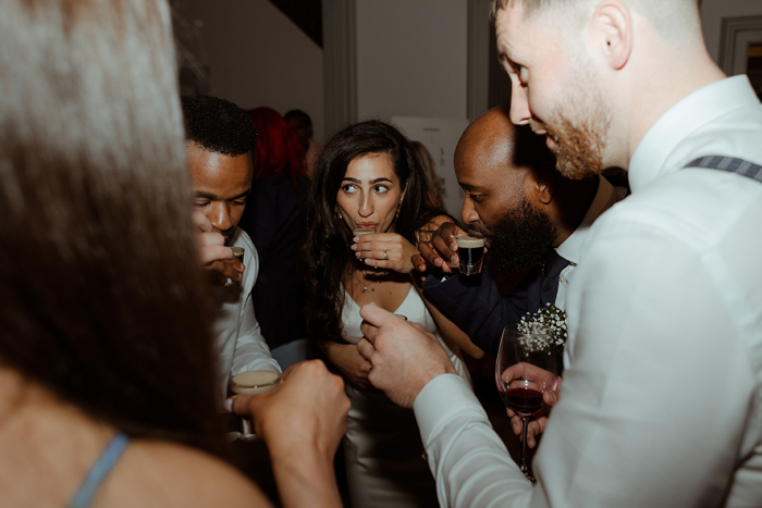 People about to drink from shot glasses 