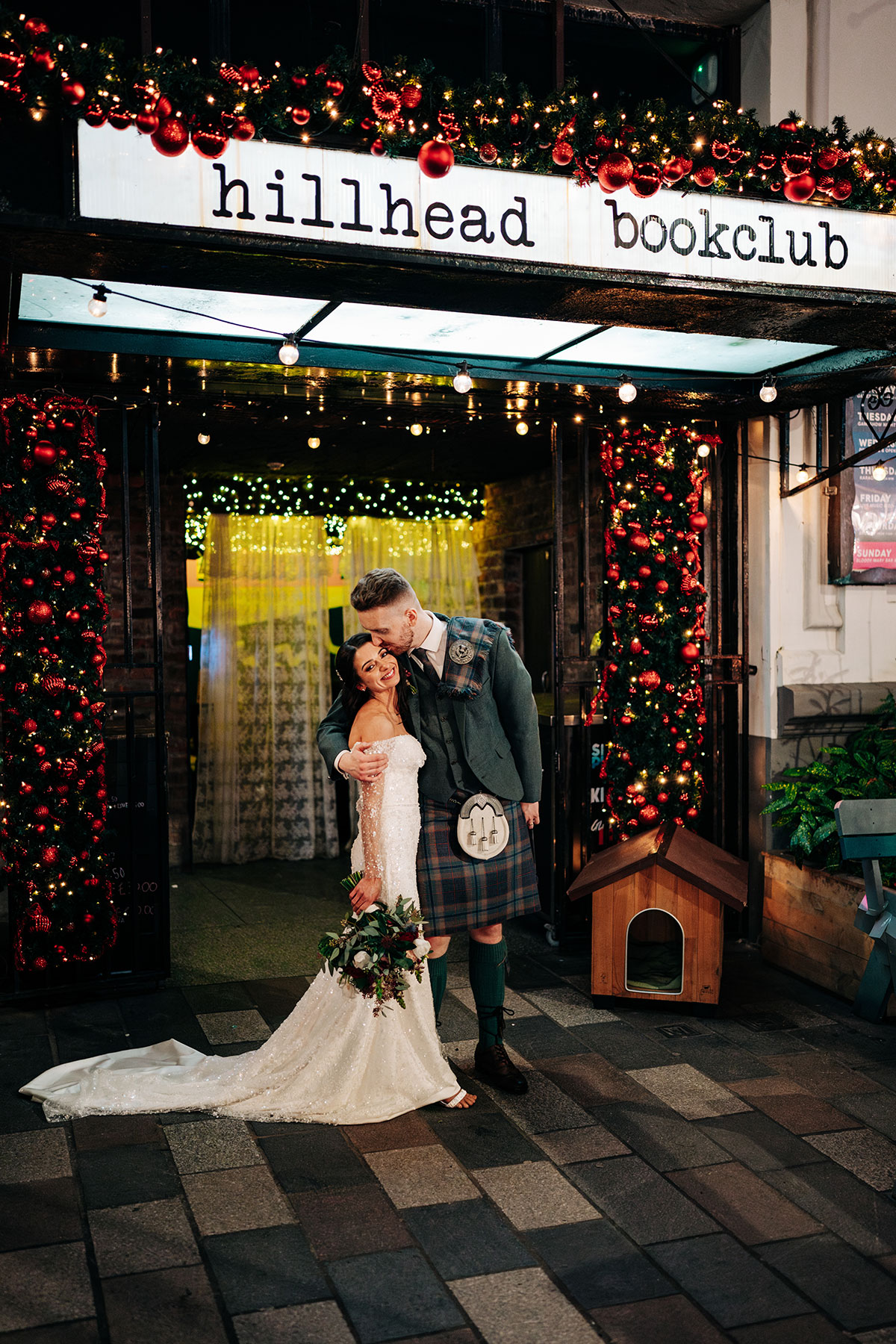 bride and groom smile outside hillhead bookclub in glasgow
