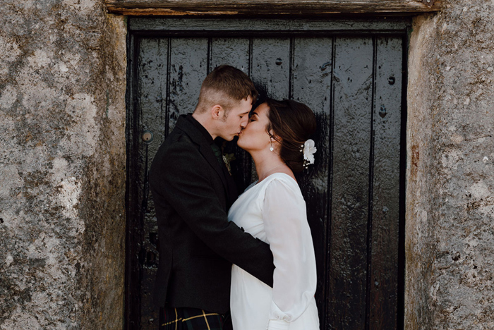 Bride and groom share a kiss