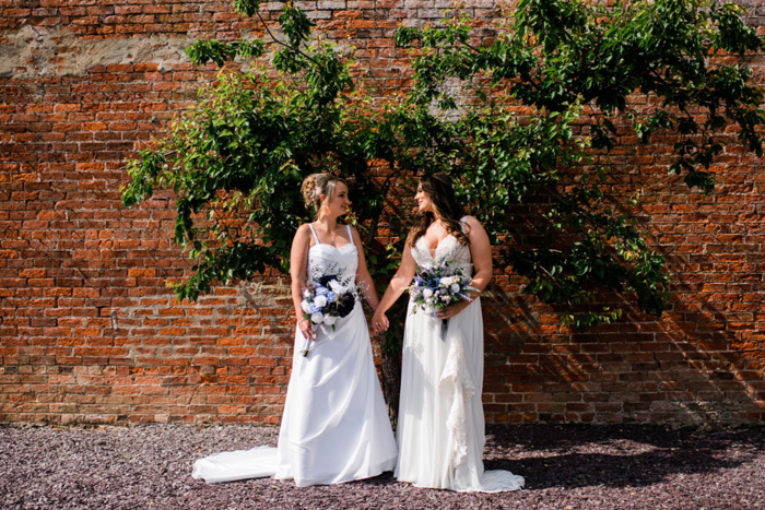 Bridal portraits against brick wall outside