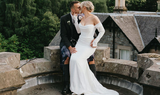 bride and groom kissing on wedding day at atholl palace hotel
