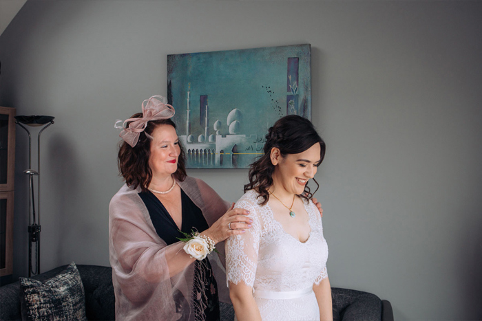 A Lady Touching A Bride On The Shoulders