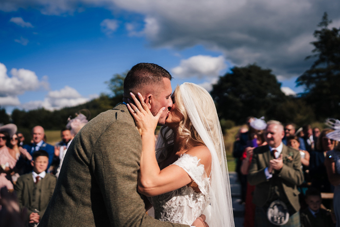 Bride and groom kiss after the ceremony