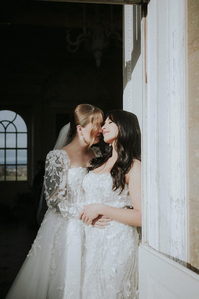 brides hugging in sunlight Chatelherault shoot