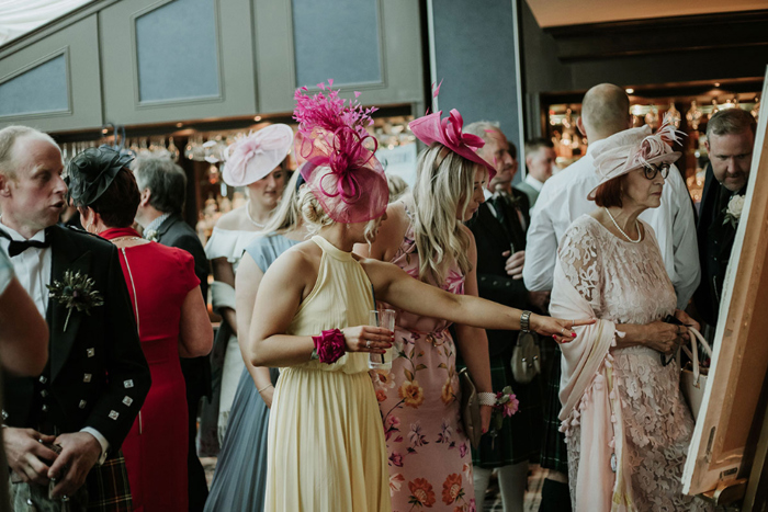 Wedding Guests Checking The Table Plan