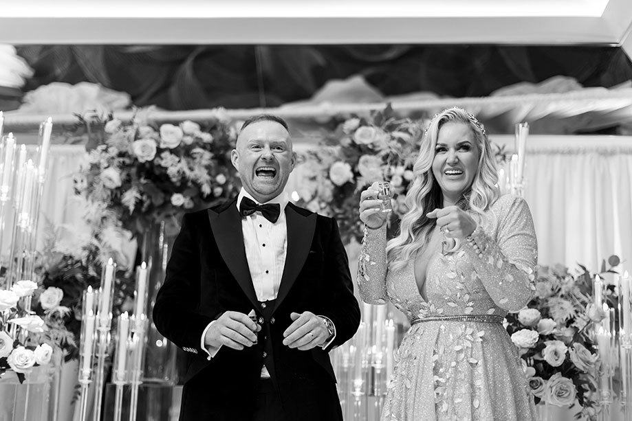 a laughing bride and groom