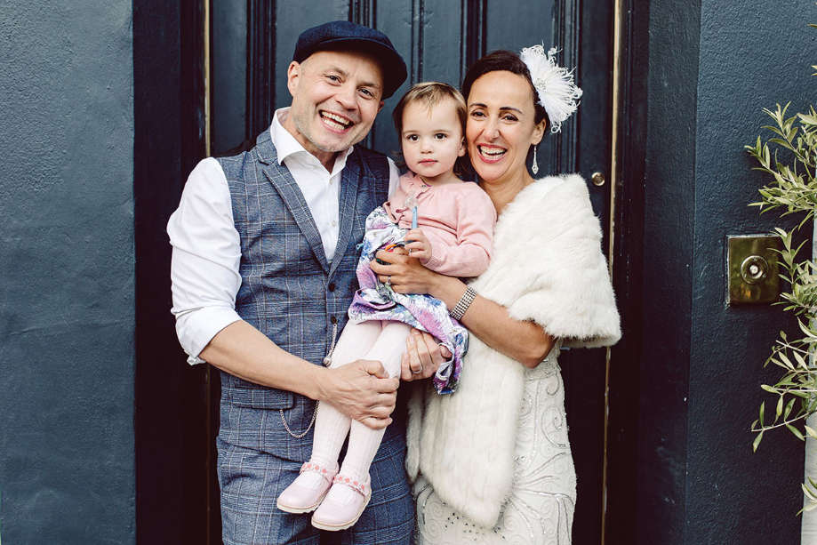 Bride, groom and daughter family portraits