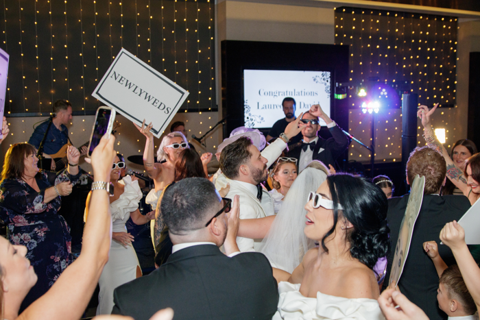 busy dancefloor with band on stage