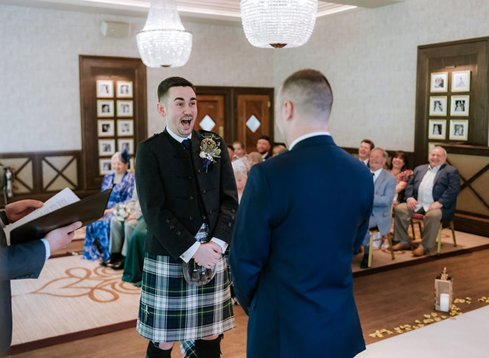 a surprised groom during a wedding ceremony