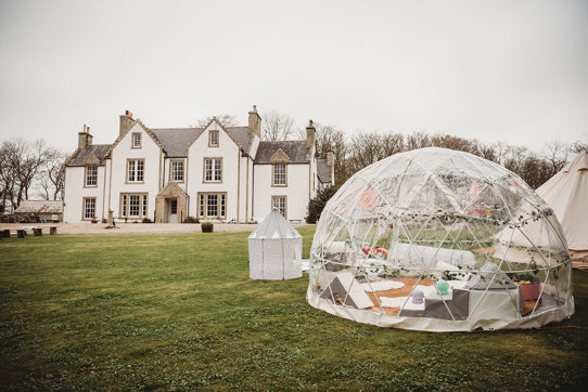 Igloo in front of exterior of Stemster House