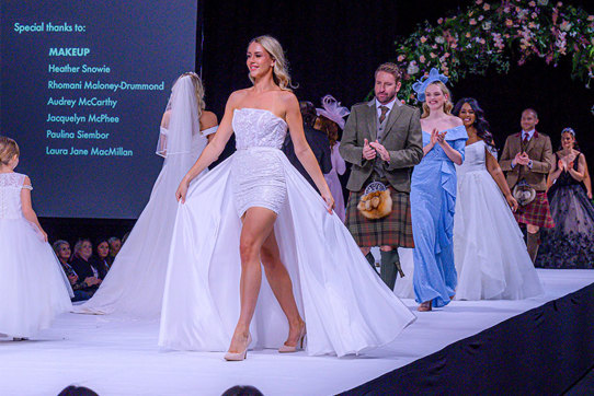 Models walking in wedding clothes on a catwalk 