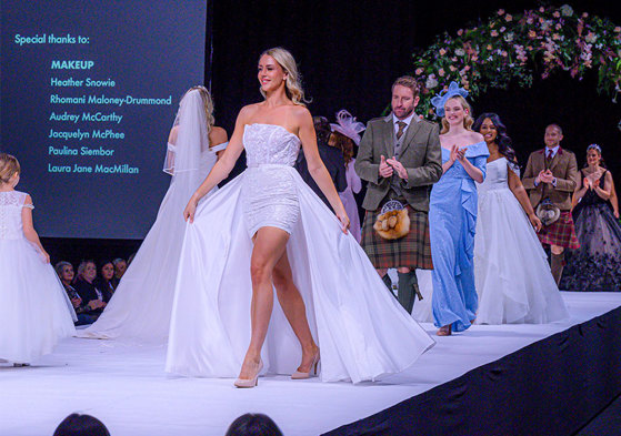 Models walking in wedding clothes on a catwalk 