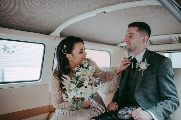 Bride and Groom in wedding car