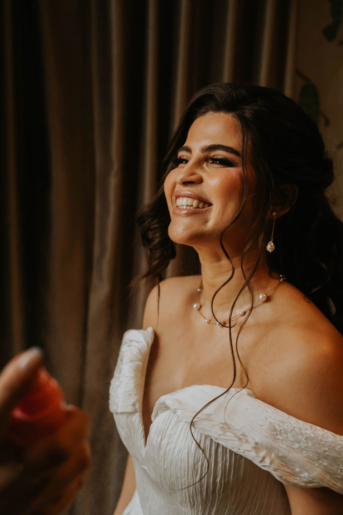 A close up of a bride smiling 