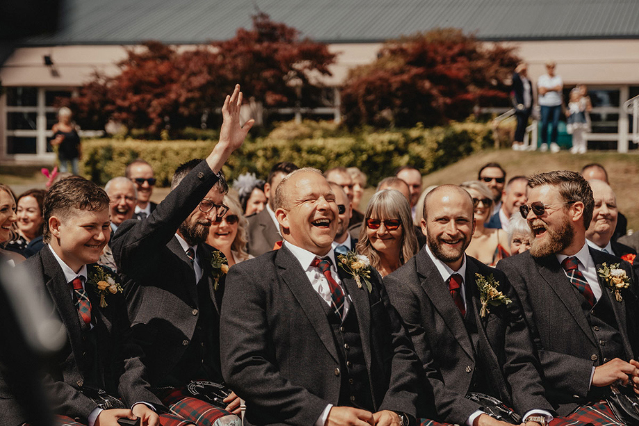 Guests laugh during ceremony