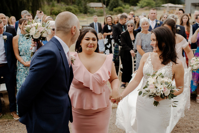 Bride's daughter cries as she gives her mother away on wedding day