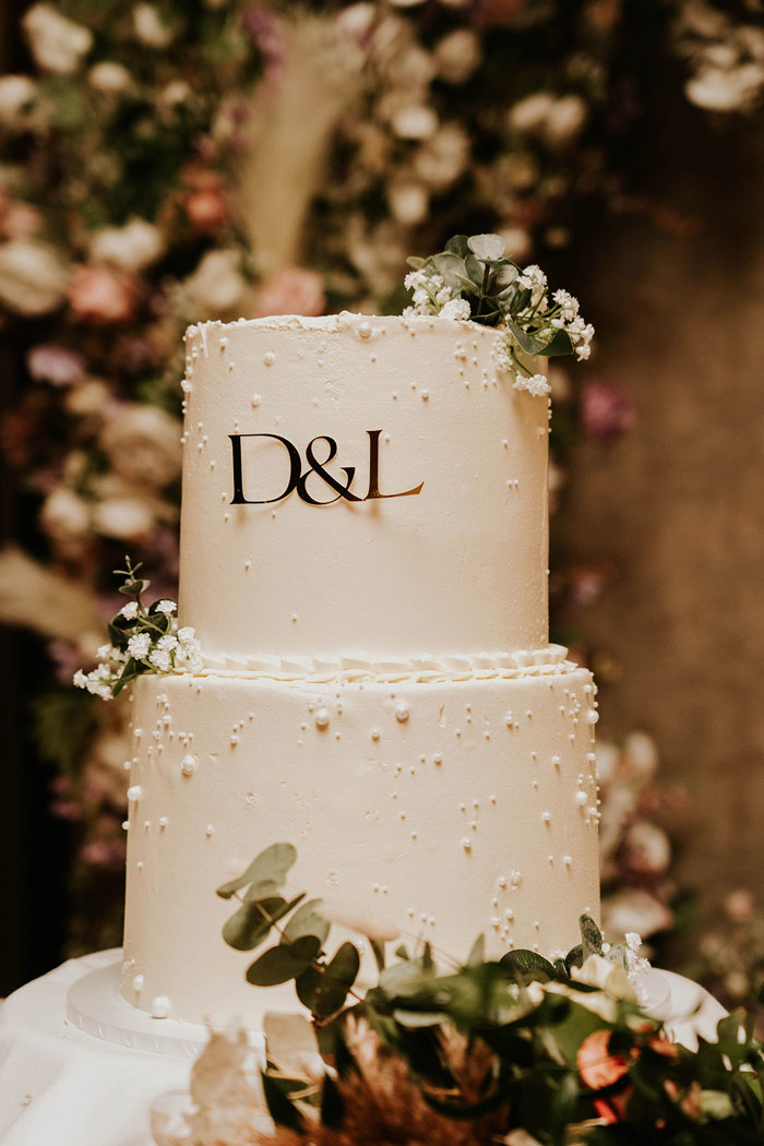 A white cake with flowers.