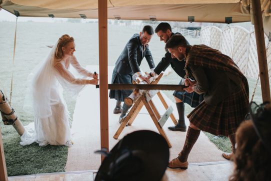 Couple partake in Bavarian wood cutting tradition