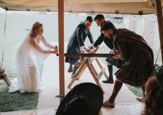 Couple partake in Bavarian wood cutting tradition