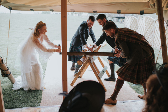 Couple partake in Bavarian wood cutting tradition