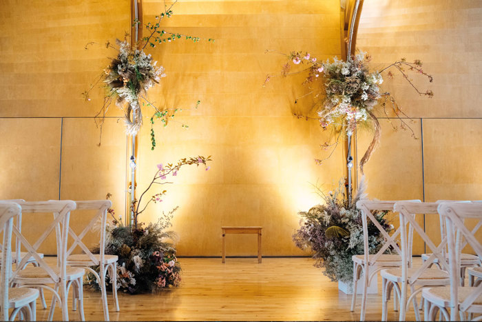 For this wedding in a rooftop dance studio, the Revelry duo organised dried florals from Worm to highlight the beams (Photo: mariannechua.com)