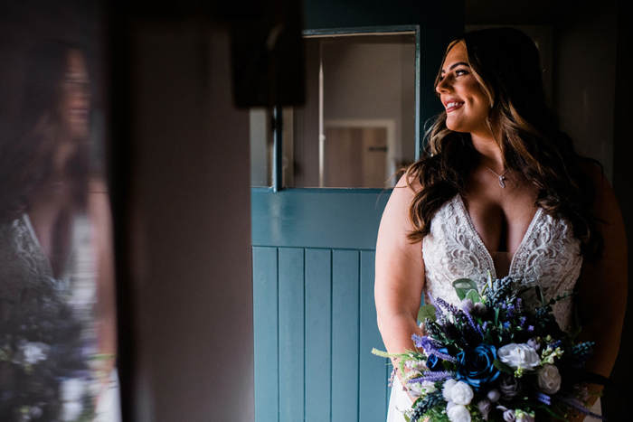 Bridal portrait against blue door