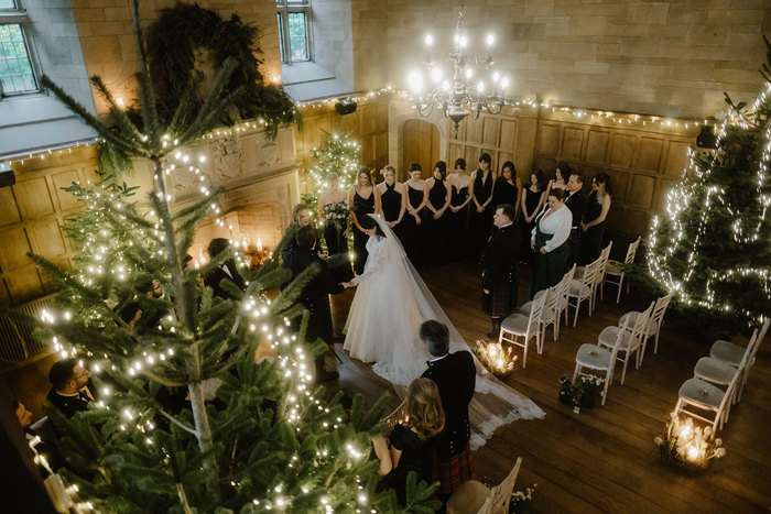 an aerial image of a wedding ceremony in the ballroom at Achnagairn Castle.