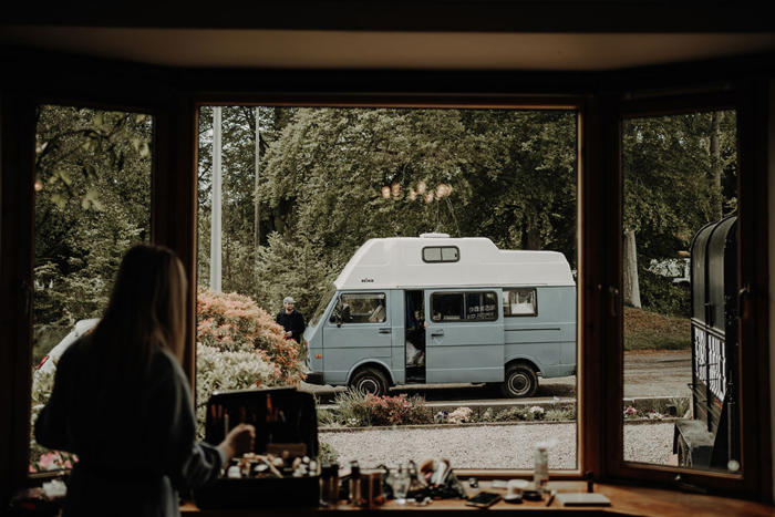 Bridal Makeup Artist sets up with blue van outside in background