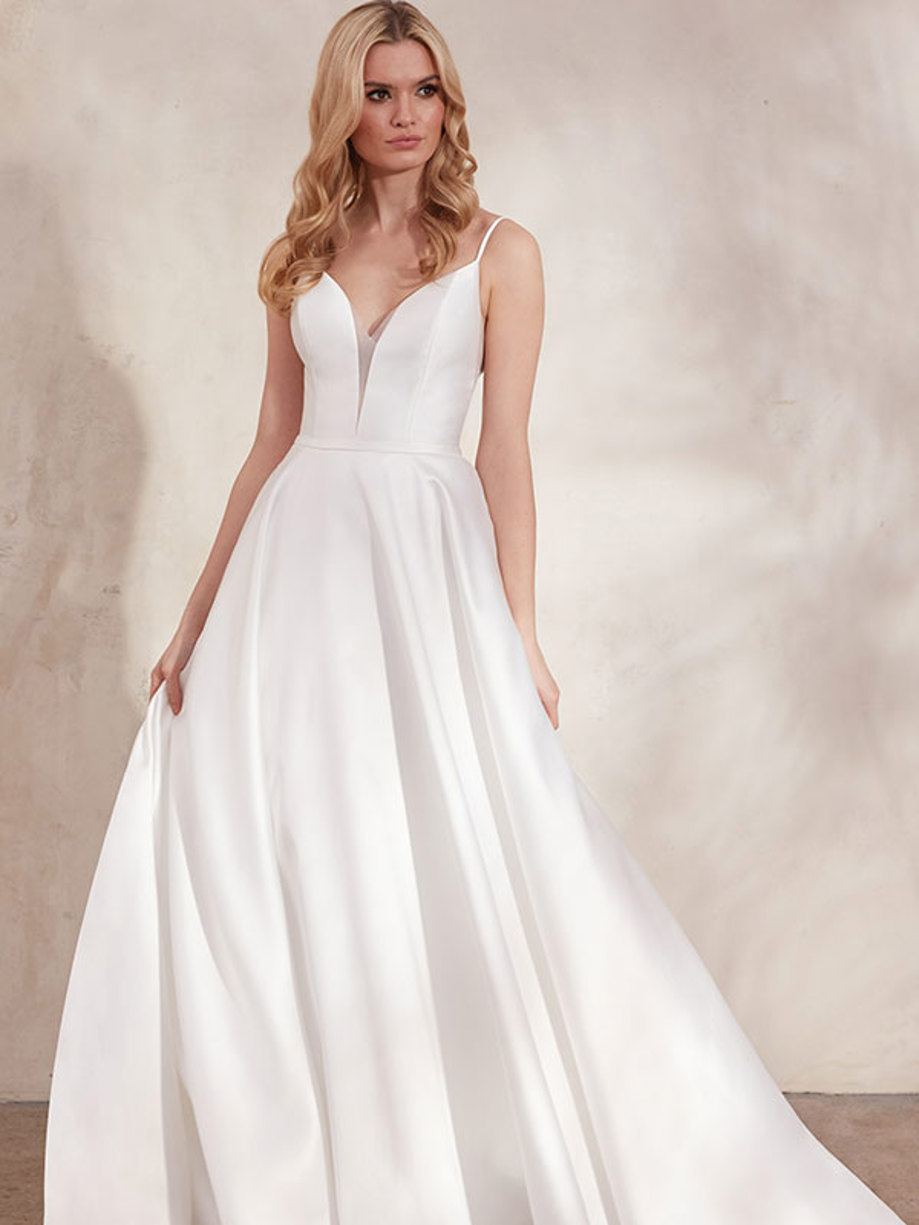 blonde in a low v-neck wedding dress with ballgown skirt