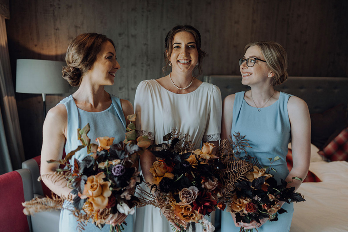 Bride and bridesmaids holding bouquets