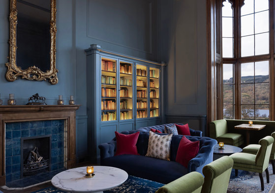 Mar Hall Member's Lounge with blue sofa and green chairs