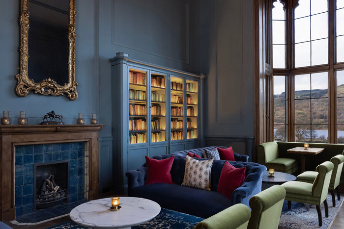 Mar Hall Member's Lounge with blue sofa and green chairs