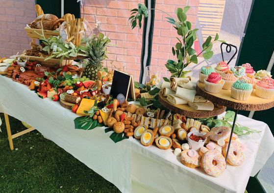 Grazing table set up with savoury and sweet food