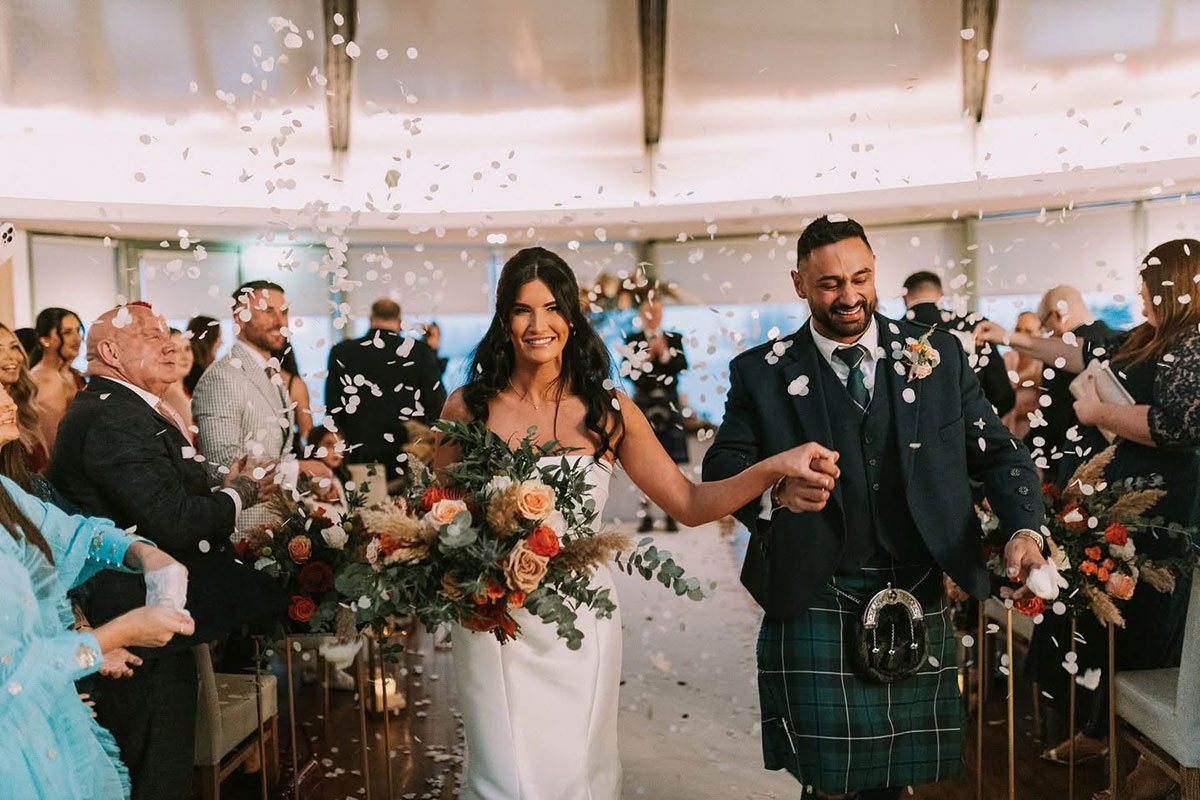 A confetti shower inside the Waterlily Suite at The Vu central Scotland sustainable wedding venue
