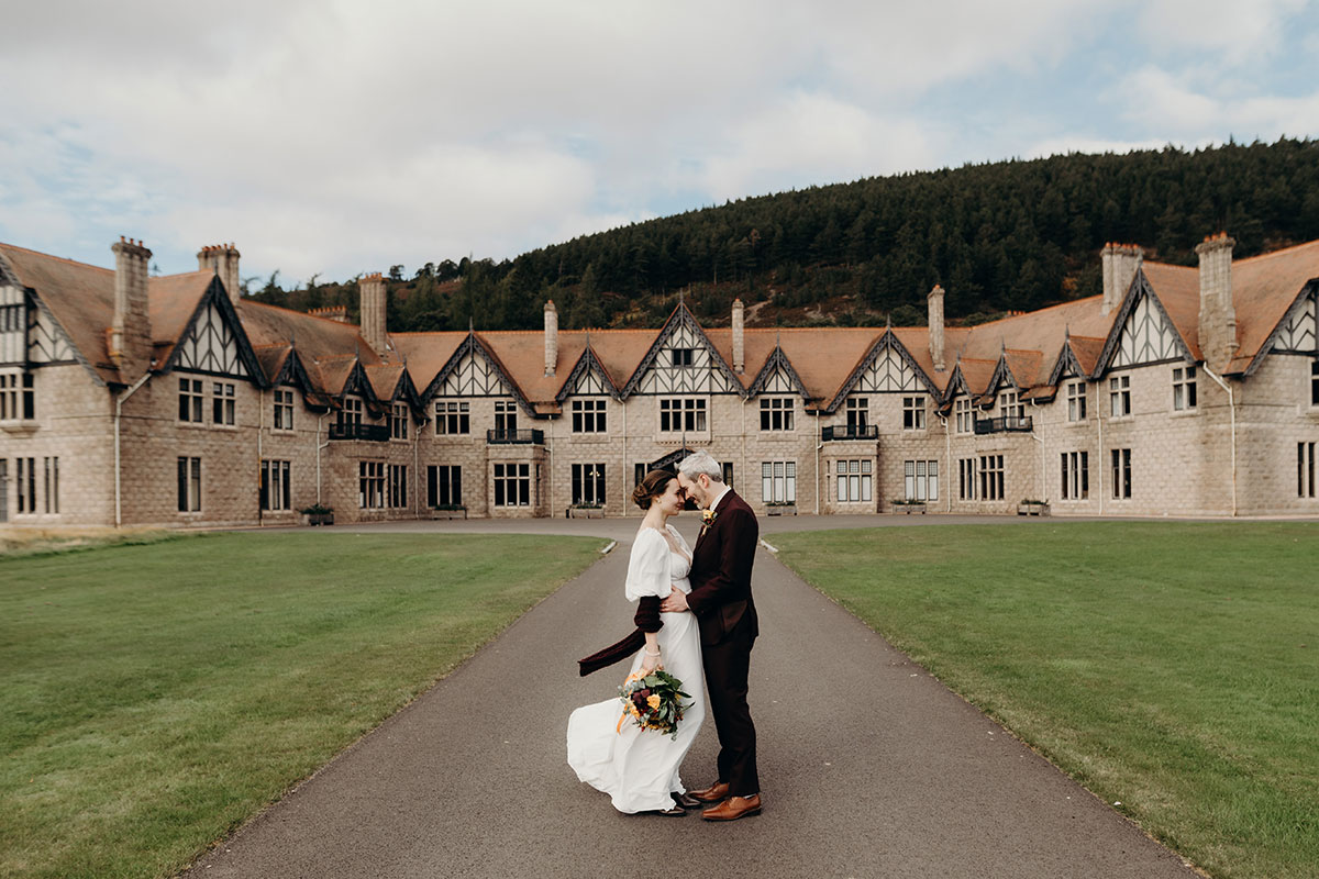 Mar Lodge Victorian Hunting Lodge exterior with bride and groom
