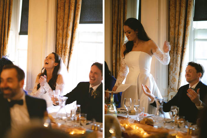 Two People Seated At A Table And Laughing On Left And Bride Standing Making A Speech On Right