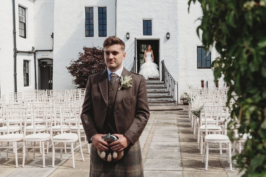 Groom waits on bride for their first look